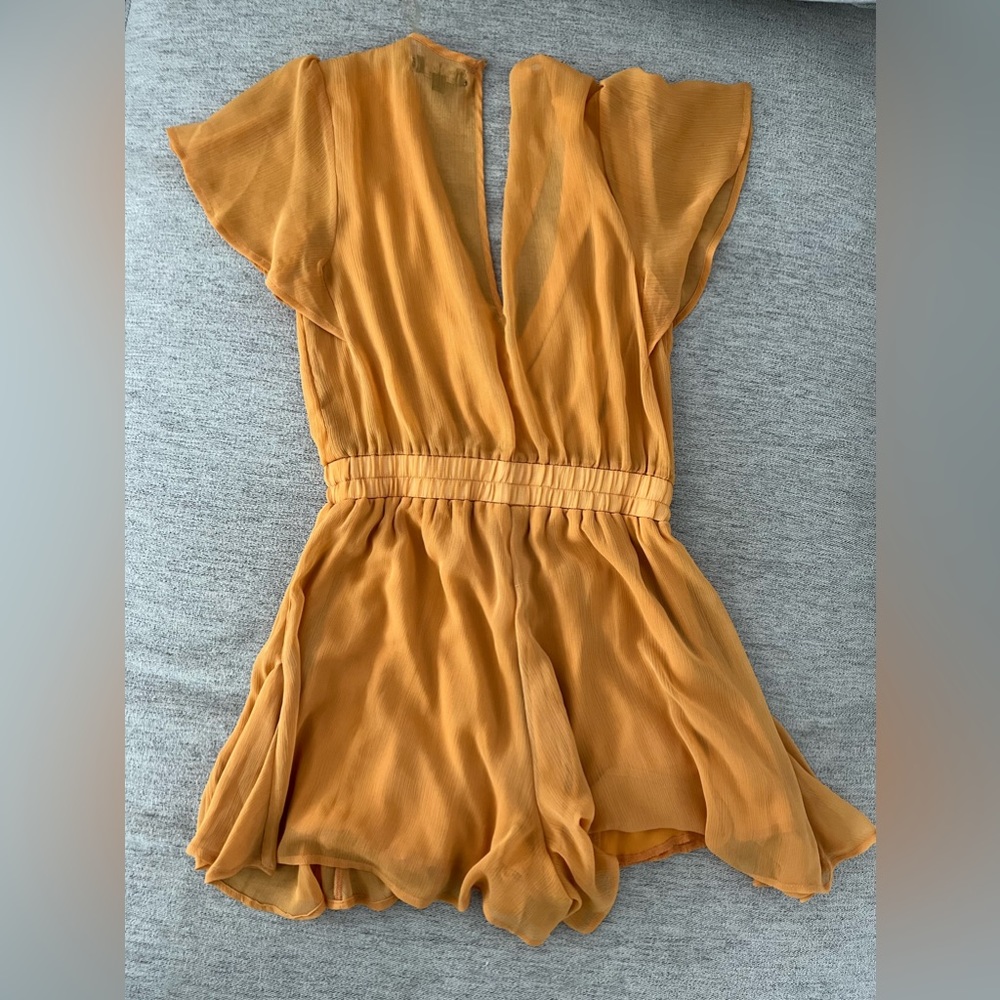 Small. Romper. Good coverage on the bum. Super cute. Dress up or down.